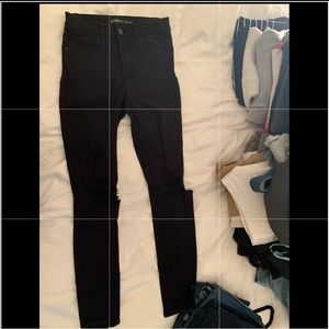 High waisted, ripped black jeans